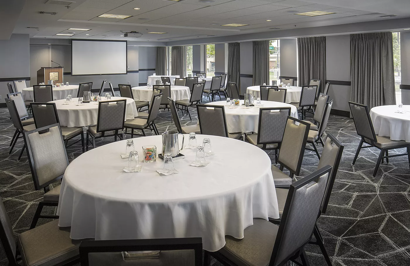 Meeting setup with round tables in Assembly room