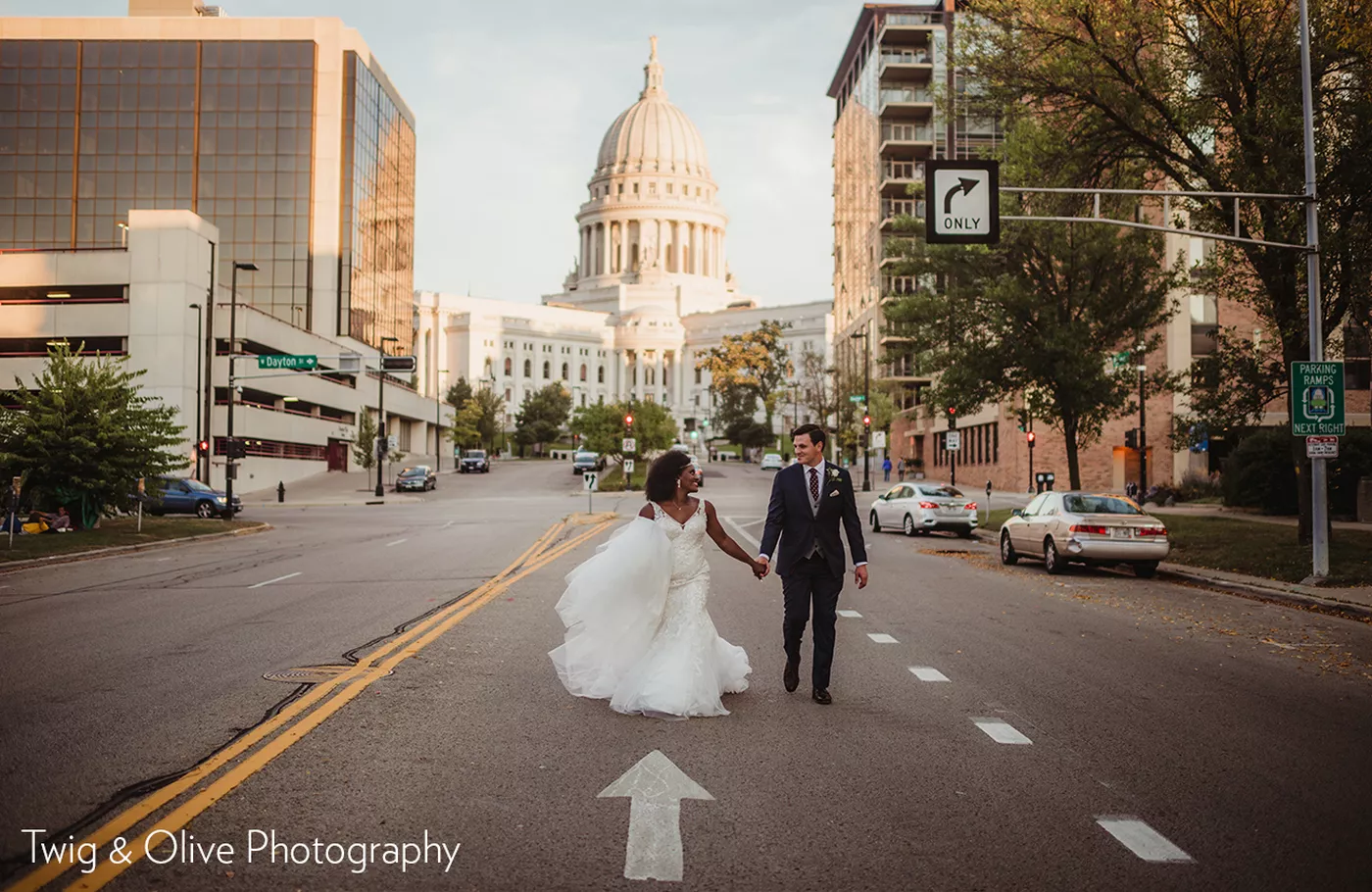 Bride and Groom in front of Wisconsin state capitol and hotel by Twig & Olive Photography