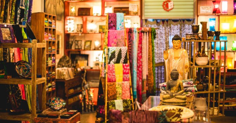 A photograph of statues, home decor, tapestries, and more that showcase what is for sale at Art Deco in downtown Madison.