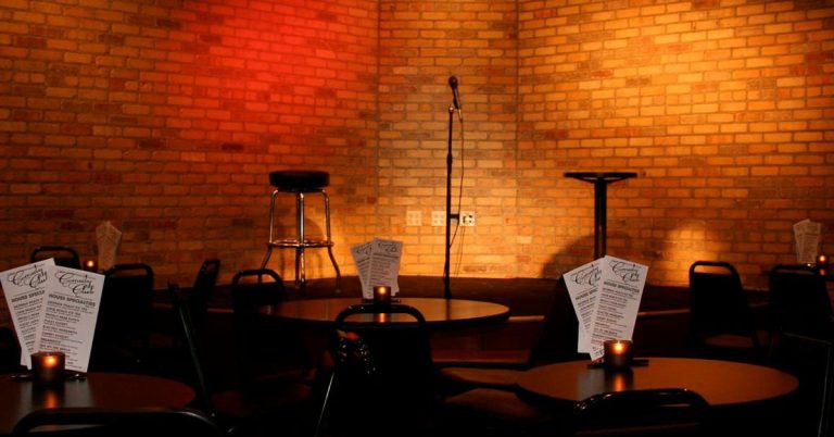 A view of audience seating and the stage at Comedy on State.