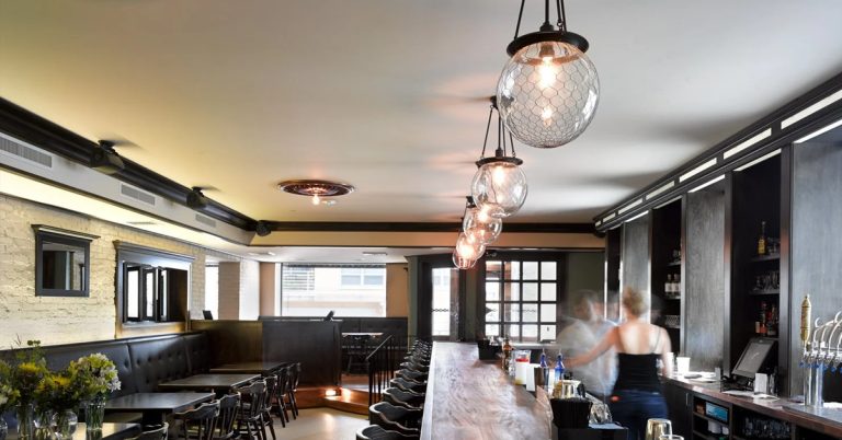 The sleek, modern, minimalist interior of the dining room and bar at Heritage Tavern.