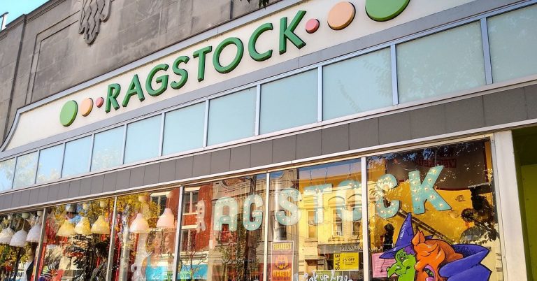 The storefront of Ragstock in downtown Madison, featuring a vibrant exterior and eye-catching displays of vintage clothing, trendy apparel, and eclectic accessories.