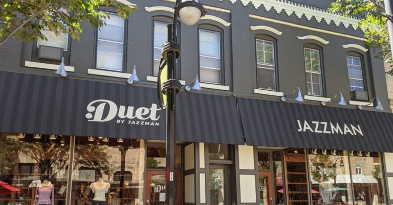 The storefront of Duet and Jazzman in downtown Madison, featuring elegant window displays and a welcoming exterior showcasing the boutique’s selection of men and women’s clothing, accessories, and distinctive gifts.